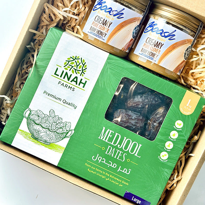 Egyptian Medjool dates and creamy raw clover honey arranged together — Linah Farms and Boosh the Beekeeper.