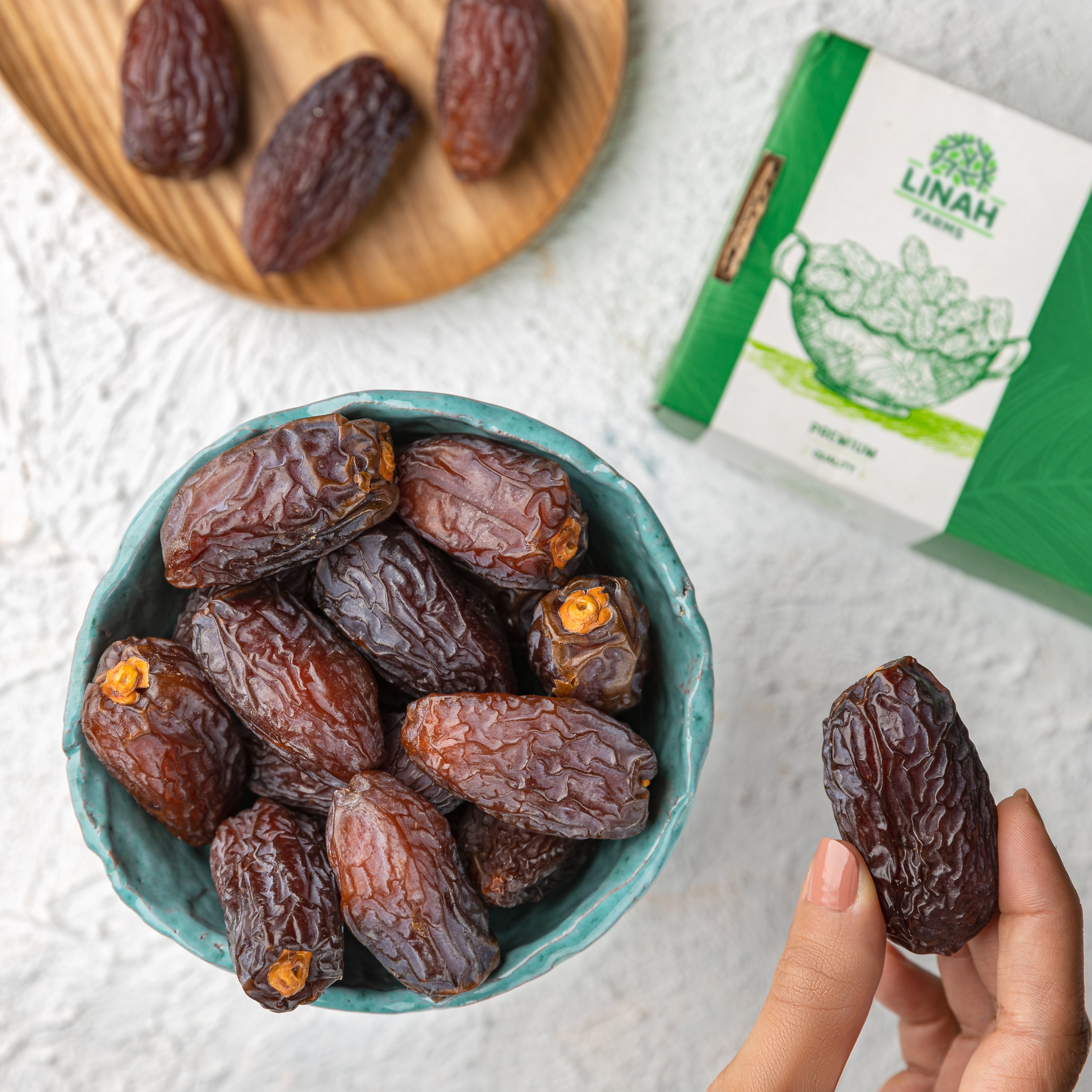 Linah Farms Egyptian Medjool dates, deep mahogany skin and soft caramel flesh, from the Bahareya Oasis